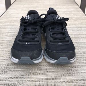 Youth black Under Armour sneakers
